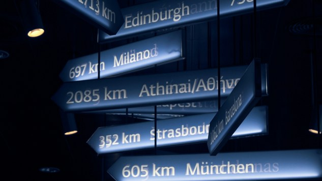 Picture of signs with the name of different cities