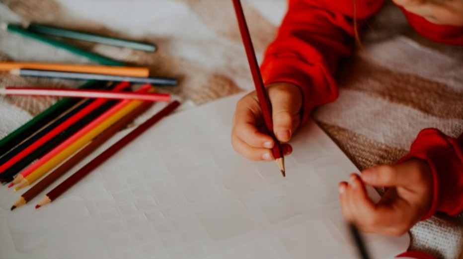 A child drawing on paper
